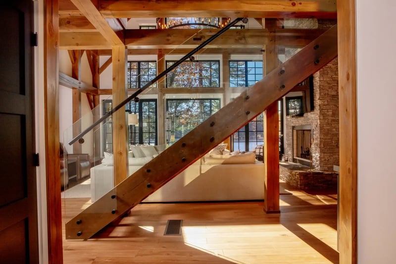 Traditional-Lakeside-Cottage-Project-Portfolio-Lakeside-Escape-Interior-Entry-View-Stairs-Great-Room-Lakeview-Normerica-Timber-Homes