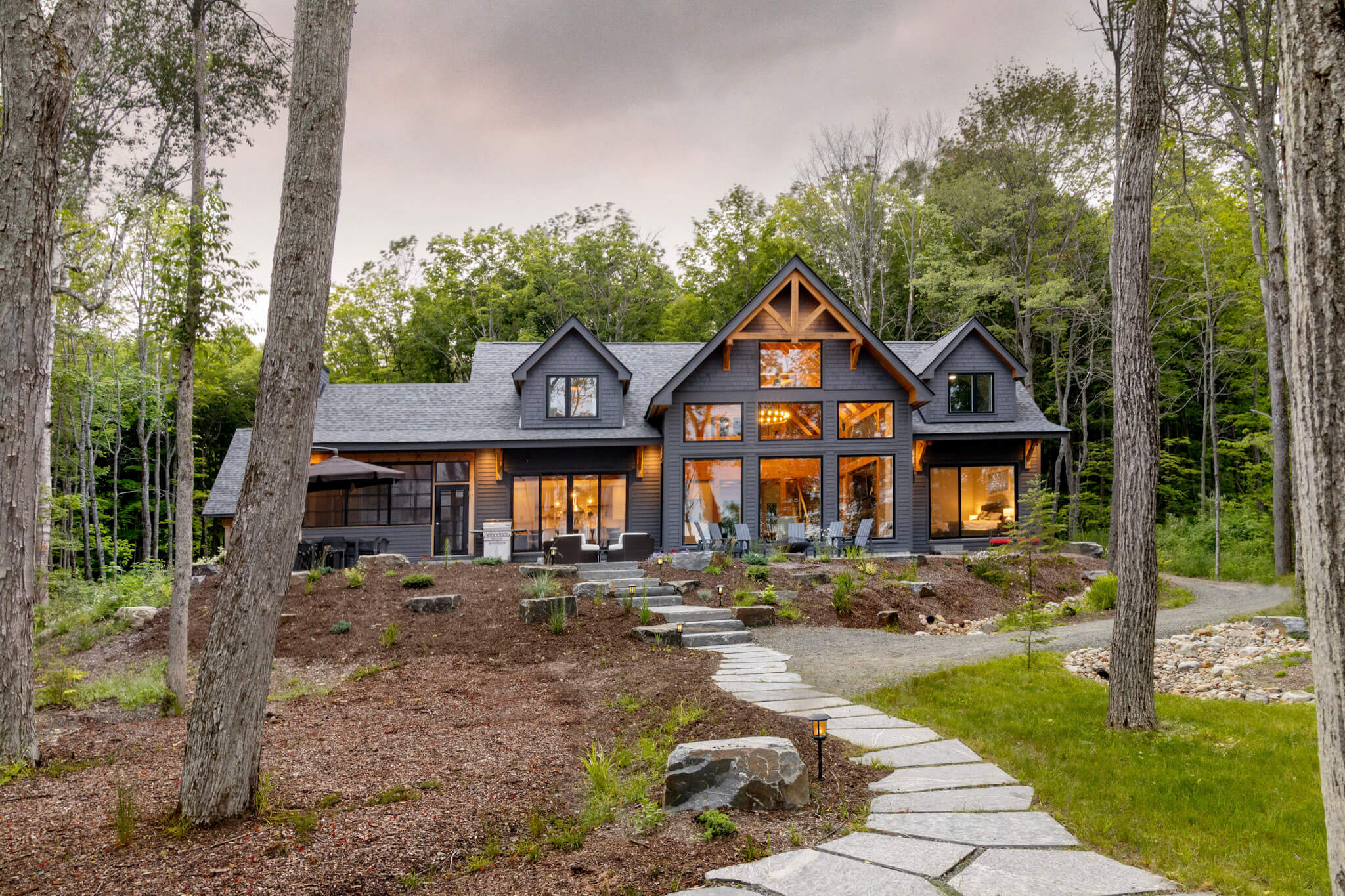 timber frame cottage designed to embrace nature and large family dockside magazine muskoka summer 2022